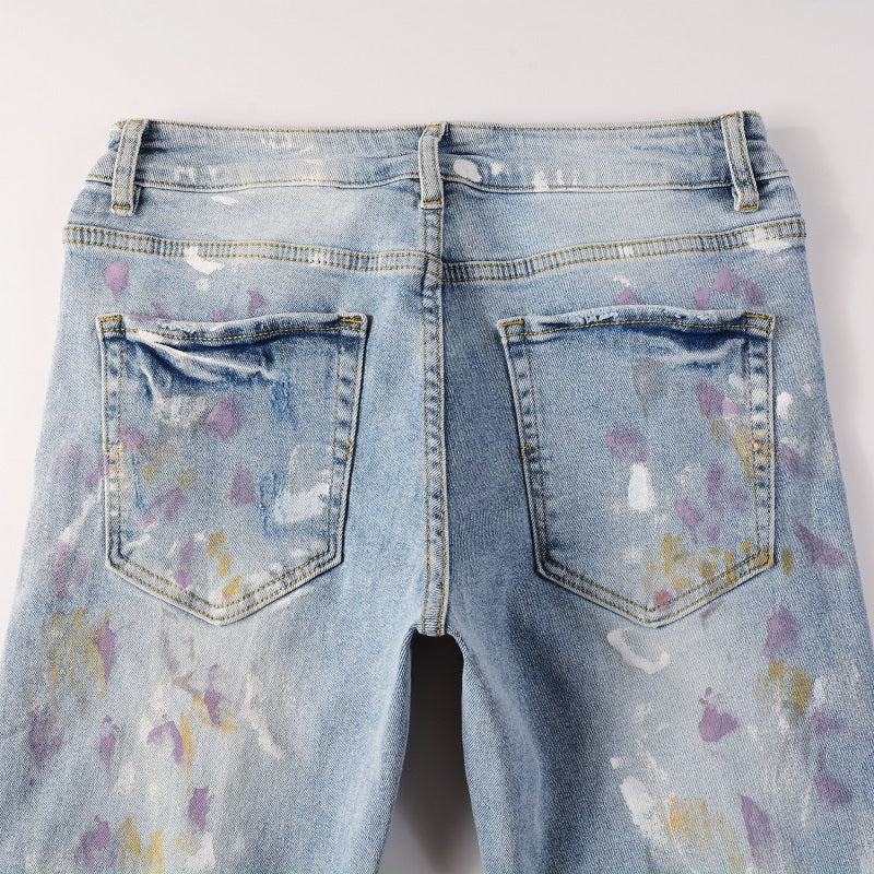 Amiri Paint Splatter Blue Jeans